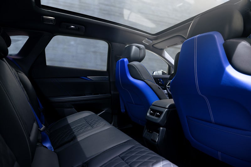 Back Seat View of the 2026 OPTIQ-V Blue Front Seats, Sun Roof, and Interior | Cody Cadillac in Montpelier VT